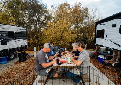 family eating at campsite