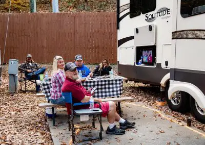 family watching tv at campsite