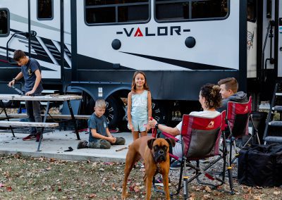 family having fun at campsite