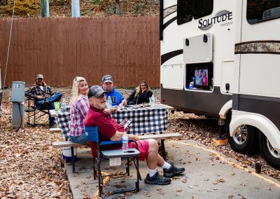 family watching tv at campsite